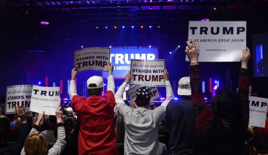Trump's supporters cheer as Republican presidential candidate Donald Trump speaks during a campaign rally at the TD Convention Center in Greenville, S.C., on Monday, Feb. 15, 2016. (Olivier Douliery/TNS)