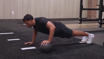 Alternating Push-up (Medicine Ball)