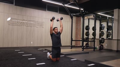 Dumbbell Overhead Kneel to Stand