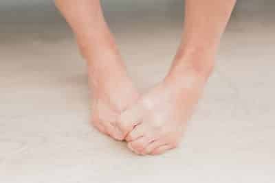 I woman hiding her toes due to ingrown toenails