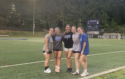 Five Cabrini women's soccer freshmen standing together after a mid-week practice on Edith Robb Dixon field.