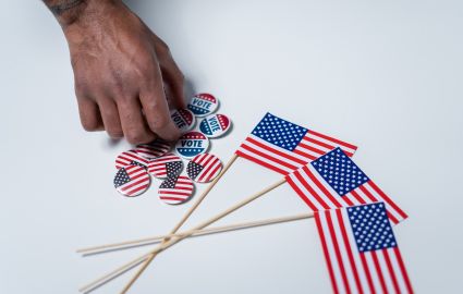 American flags and pins on white background.