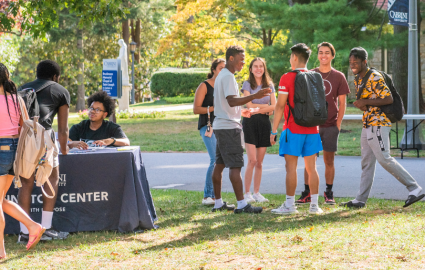 Students at the voting registration table hosted by the Wolfington Center.