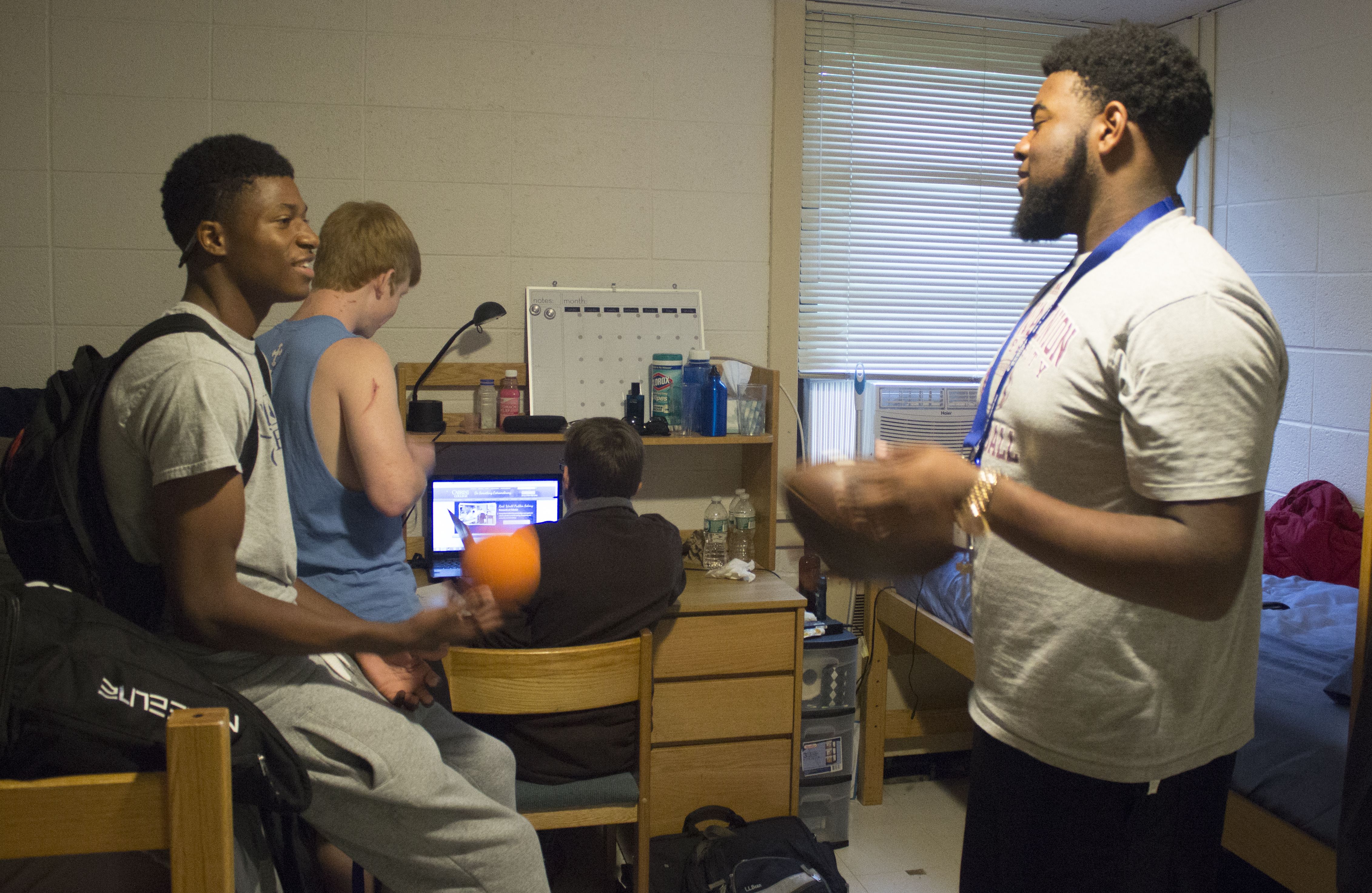 First year students (right to left) Justin Austin, Devyn Rossner, Landon Murphy and Tyheim Monroe hanging out in their room. 