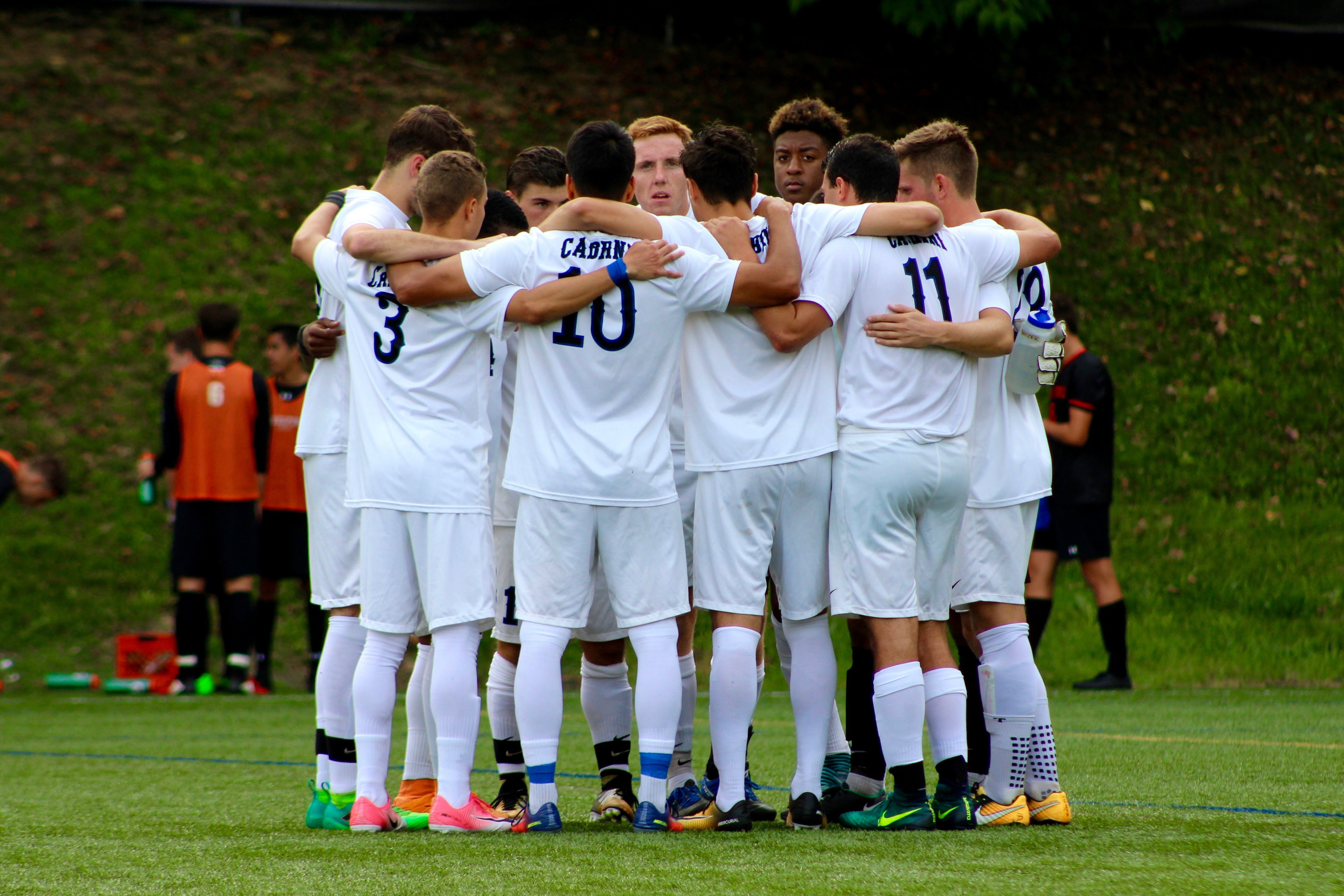 Soccer team in a huddle - Photo by Michelle Guerin