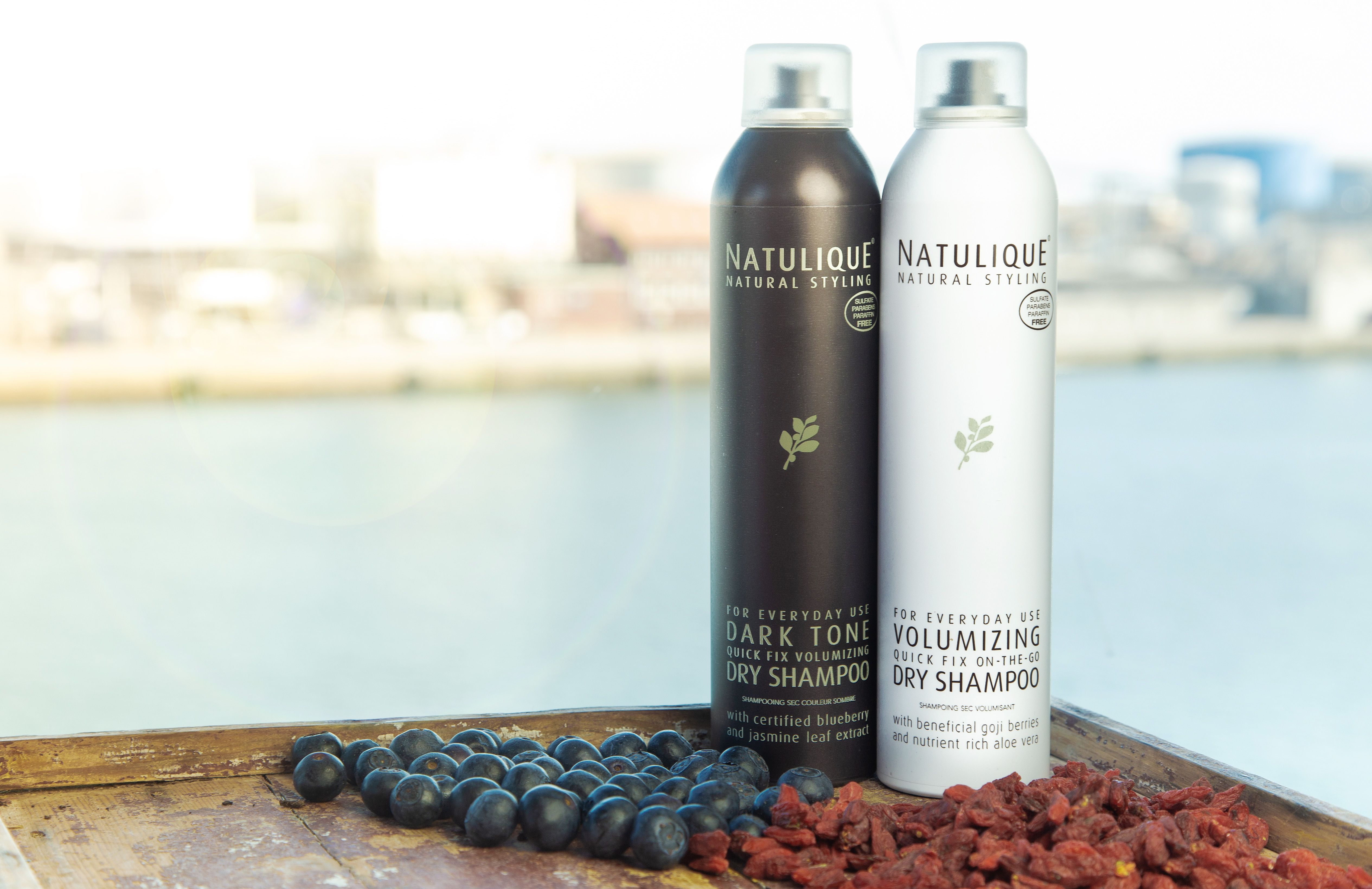 Goji and blueberries NATULIQUE dry shampoo bottles with berries
