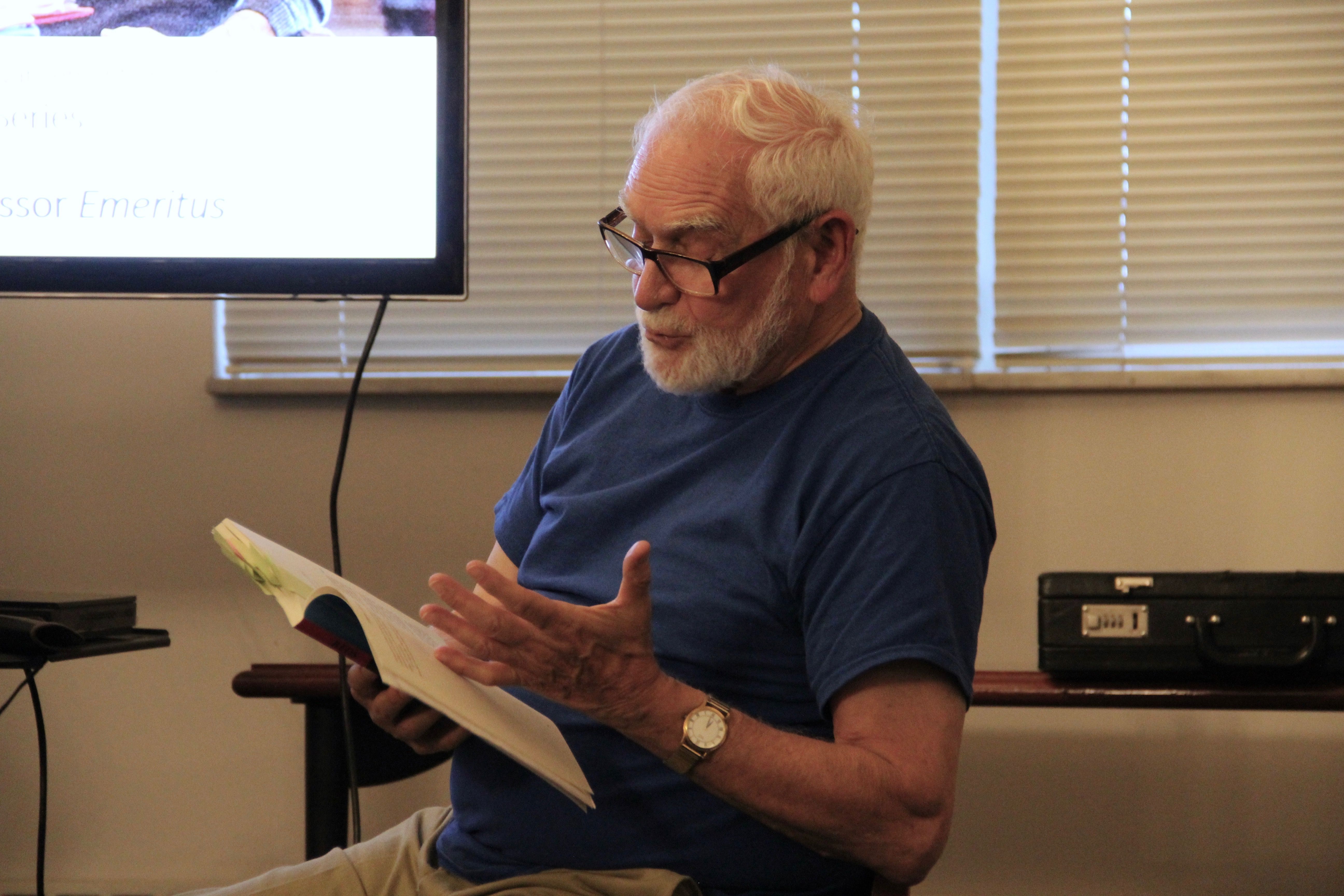 Dr. Romano reading from his book; Photo by Michelle Guerin