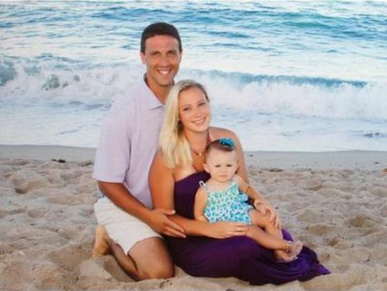 Facilities worker Eric Bascelli pictured on the beach with his fiancee Jen and his 19-month-old daughter Ella. Bascelli was diagnosed with stage three esophageal cancer in the winter, two days after proposing to Jen.