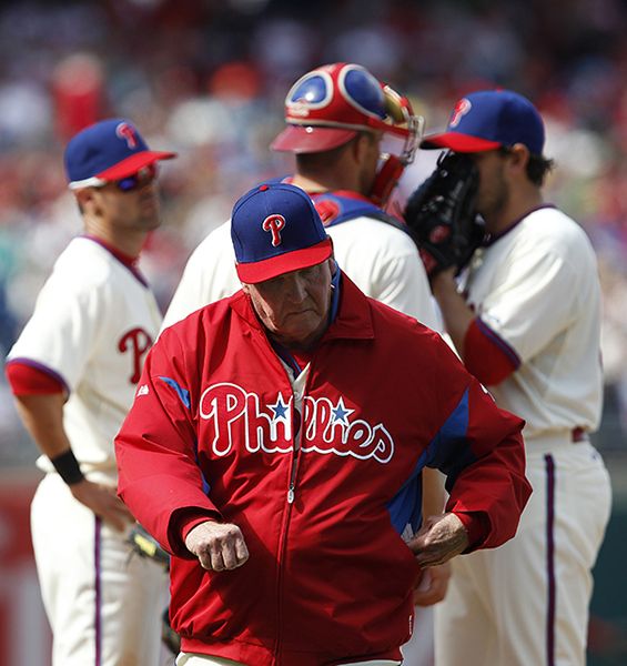 Charlie Manuel walks from the mound after making a pitching chance in the Phillies home opener on Friday, April 5. (MCT)