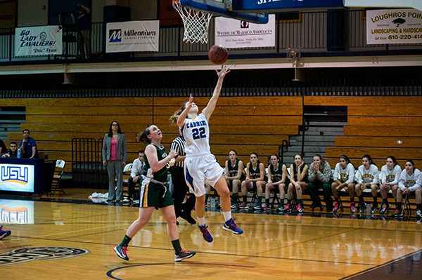Brittany Sandone (No. 22) completes a lay-up for two of her 13 points in Cabrini's 66-40 win over Marywood University on Saturday, Feb. 16. (Dan Luner / Staff Photographer)