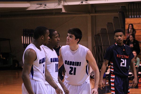 Aaron Walton-Moss, Jeremy Knowles and Fran Rafferty (pictured left to right) celebrate during Cabrini’s 94-79 win over Keystone College on Saturday, Jan. 26. (Nicholas Cipollone / Asst. Sports Editor)