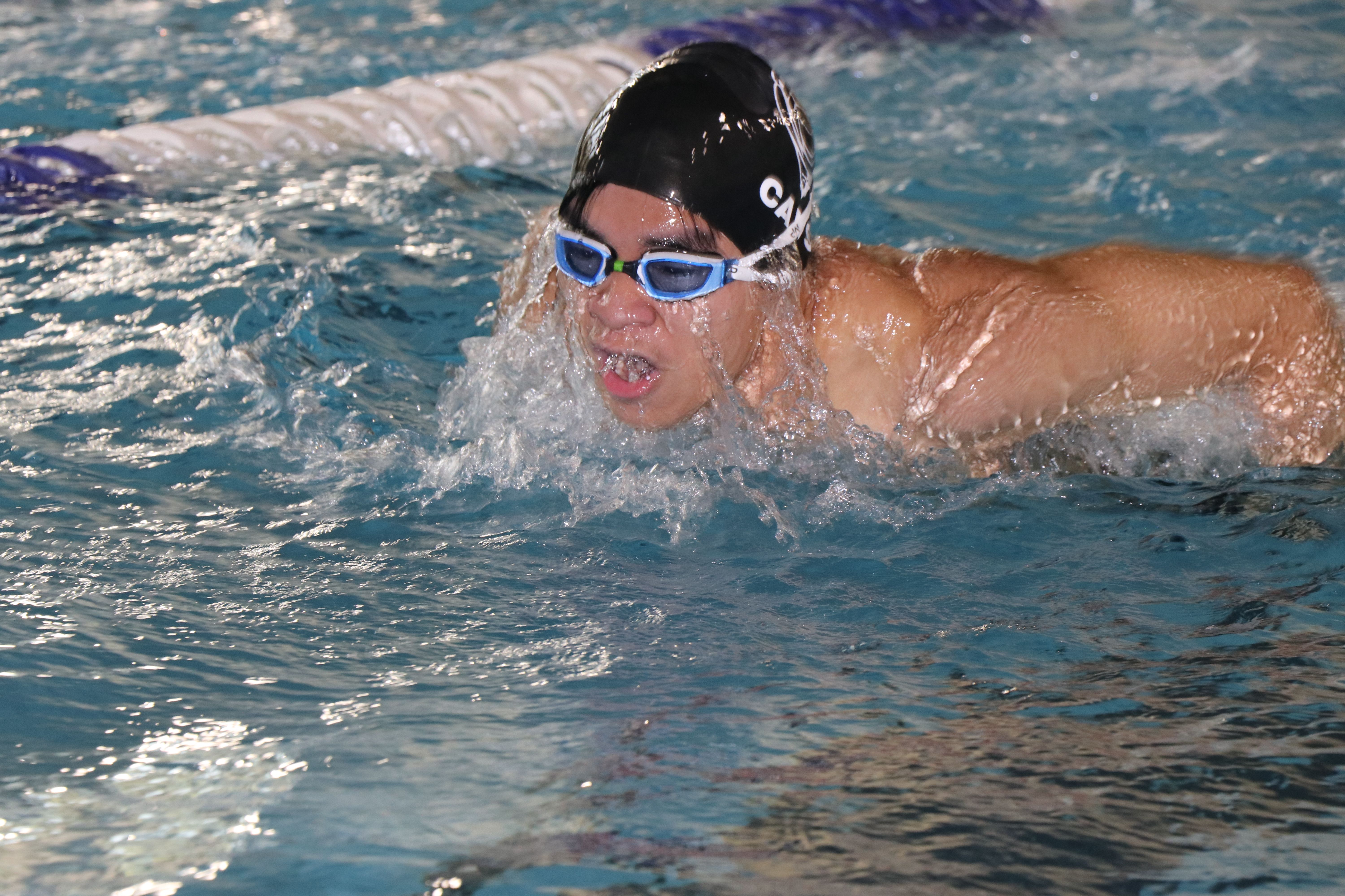 Freshman Tien Tran competing in the 200-yard fly. Photo by Gabrielle Cellucci