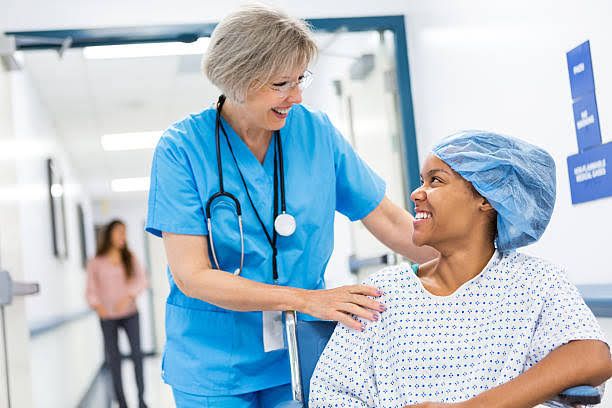 A NURSE IS PREPARING A PATIENT FOR ELECTIVE SURGERY A NURSE IS PREPARING A PATIENT FOR ELECTIVE SURGERY