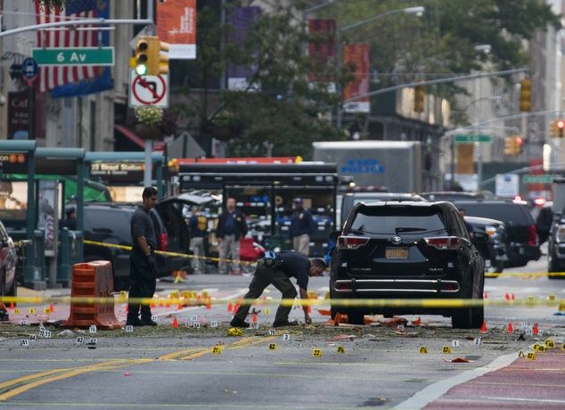 Crime scene investigators work at the scene of Saturday's explosion in Manhattan's Chelsea neighborhood, in New York, Sunday, Sept. 18, 2016. (AP Photo/Craig Ruttle)