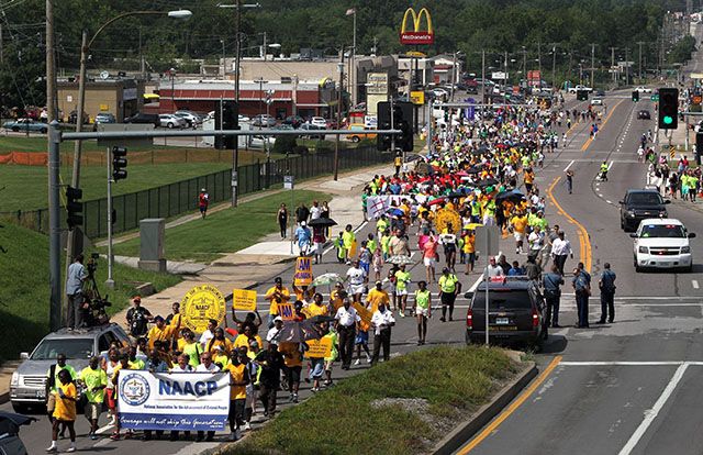 Protesters march in Ferguson, MO.., on Saturday, Aug. 23, 2014, marking two weeks since Michael Brown was shot dead by a Ferguson police officer. (MCT)