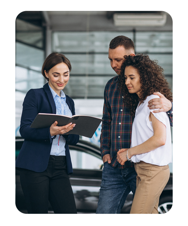 Extend the Life of Your Vehicle at Bobby Rahal Toyota in Mechanicsburg, PA | Couple side by side talking to sales associate inside of dealership