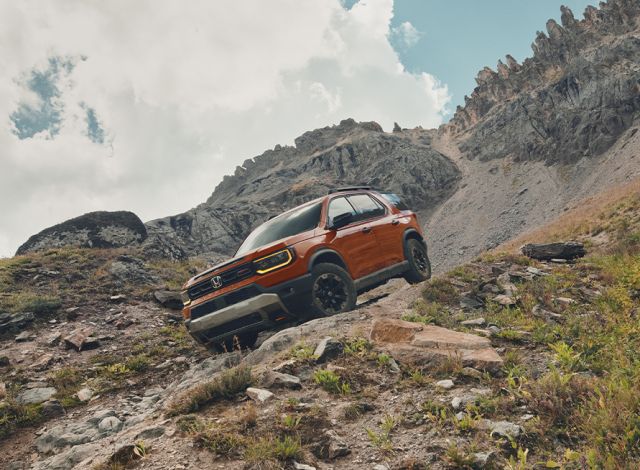 New 2026 Honda Passport at Delaney Honda | 2026 Honda Passport driving down a hill
