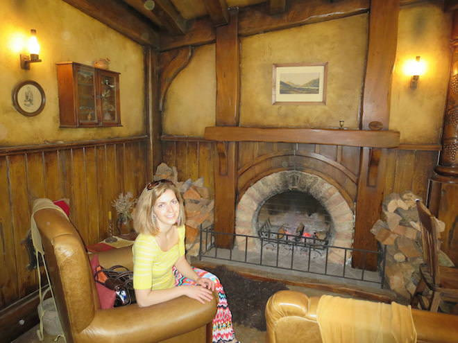 Me in a classic - not just sitting - but also slouchy posture while being on vacation in New Zealand. No matter whether you sit with a straight posture or not, you need this best hip flexor stretch to counter the effects of sitting.
