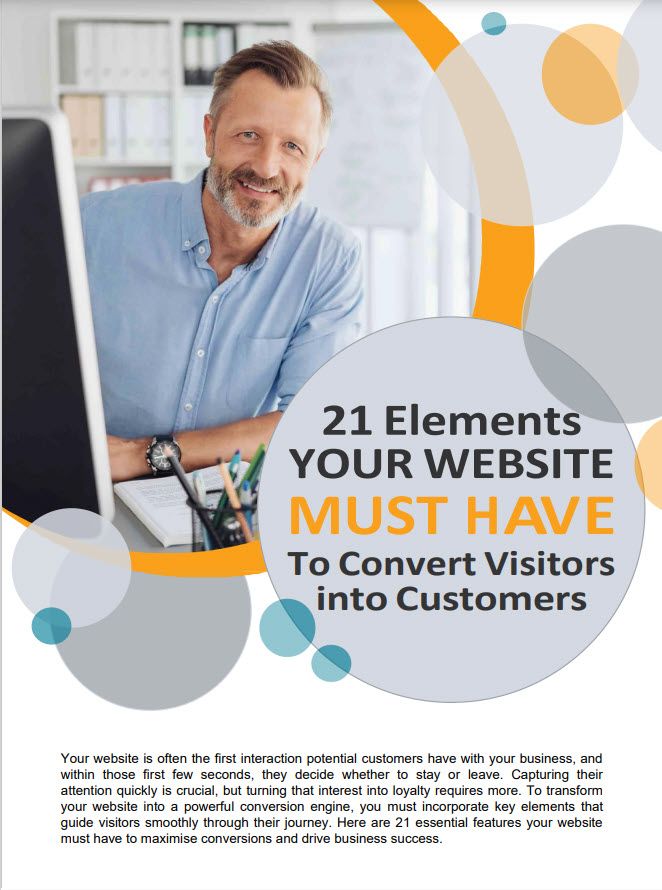 A Man With A Beard Smiles While Working At A Desk With A Computer. Text Overlay Reads &Quot;21 Elements Your Website Must Have To Convert Visitors Into Customers.