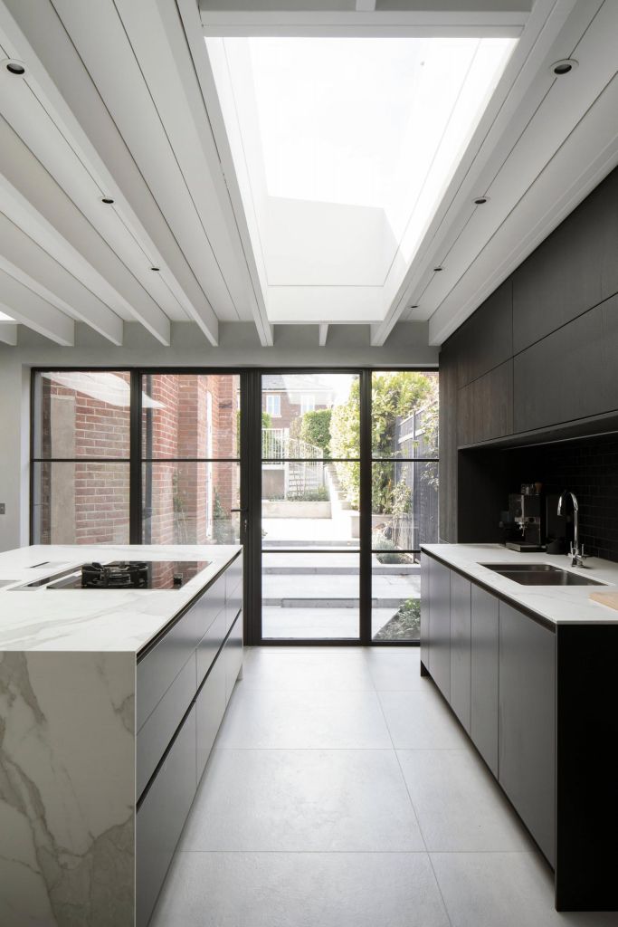 Modern kitchen with steel patio doors and rooflight