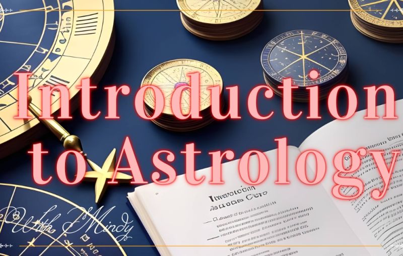 Introduction to Astrology 1 a book and compasses on a blue surface