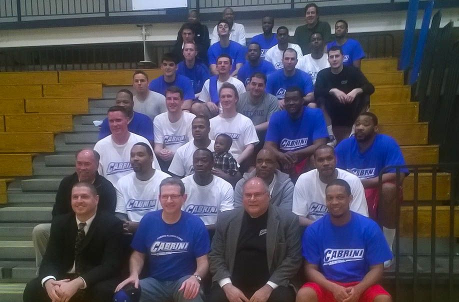 Both the women’s and men’s basketball alumni celebrate after their alumni games.